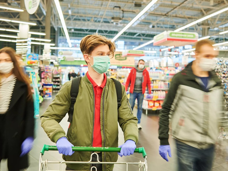 People Wearing Masks While Shopping