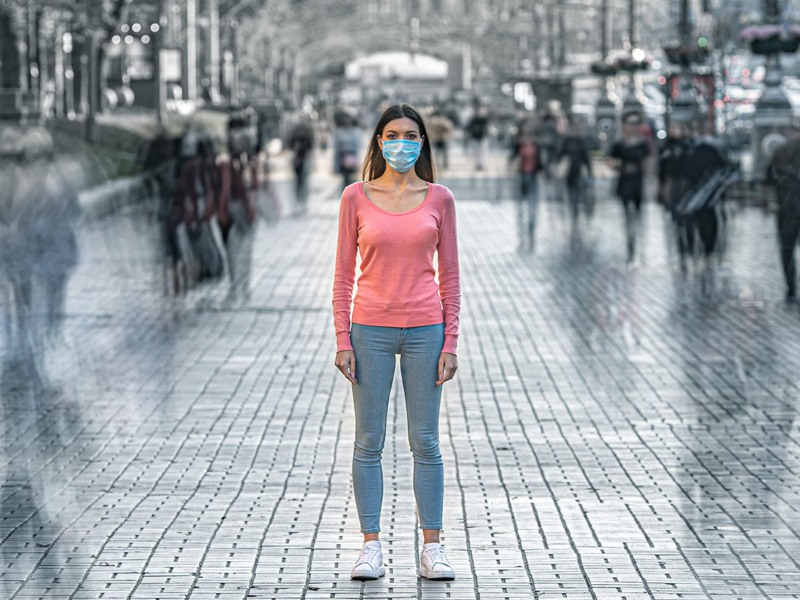 Woman in Pink Long Sleeve Shirt Wearing Mask